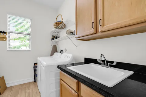 a bathroom with a sink and a window
