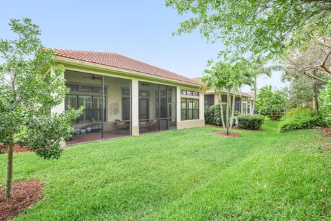 a view of a house with a backyard