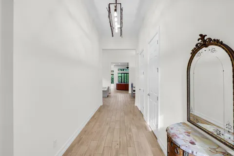 a view of a hallway view with staircase