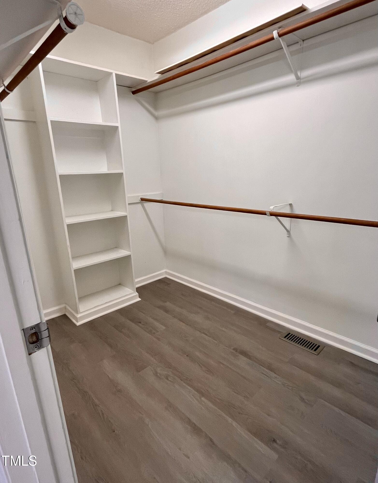 3733 Polenta Road Clayton, NC 27520 - Photo 12 of 51 a view of an empty walk in closet