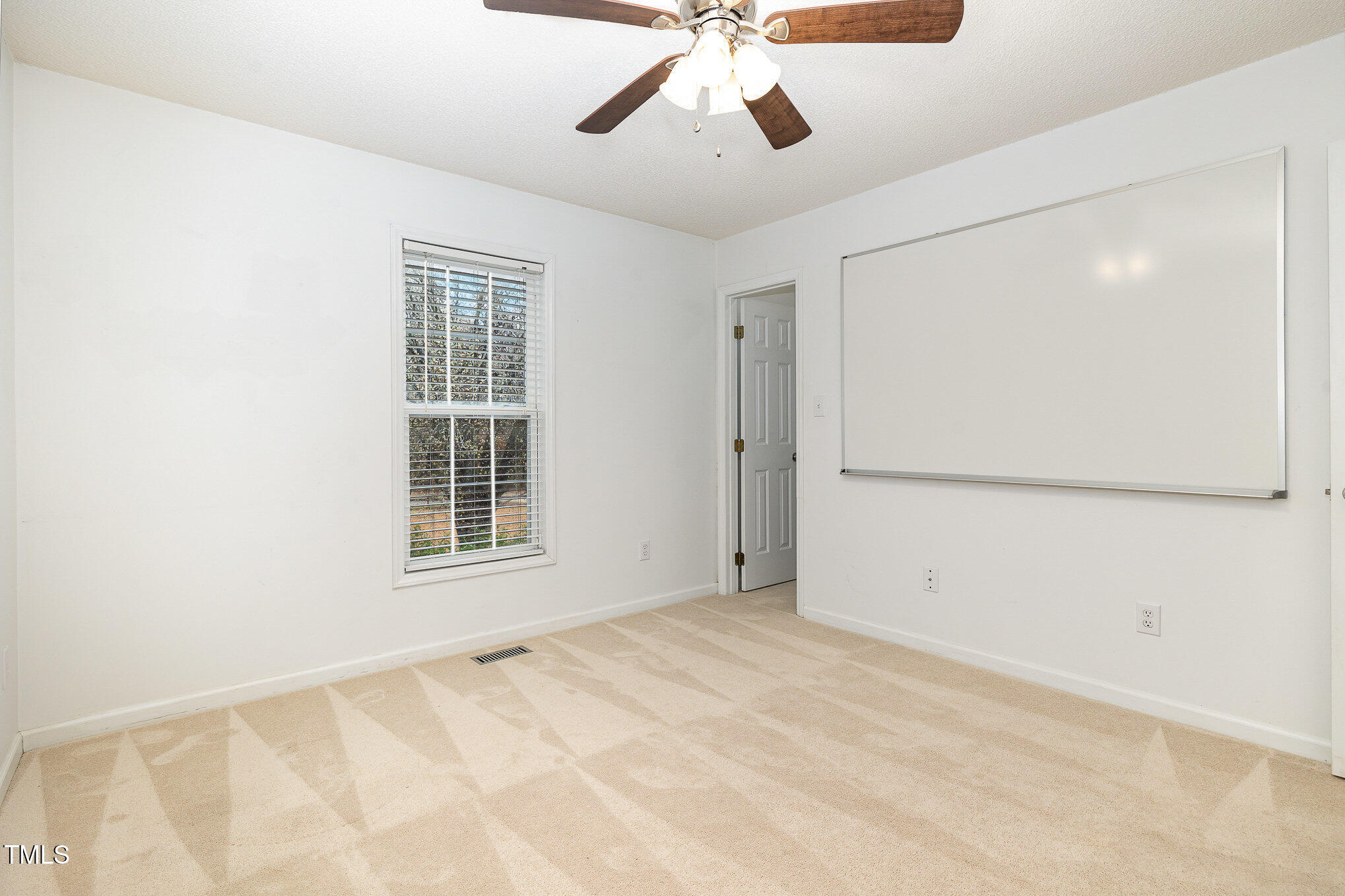 3733 Polenta Road Clayton, NC 27520 - Photo 15 of 51 a view of an empty room with a window