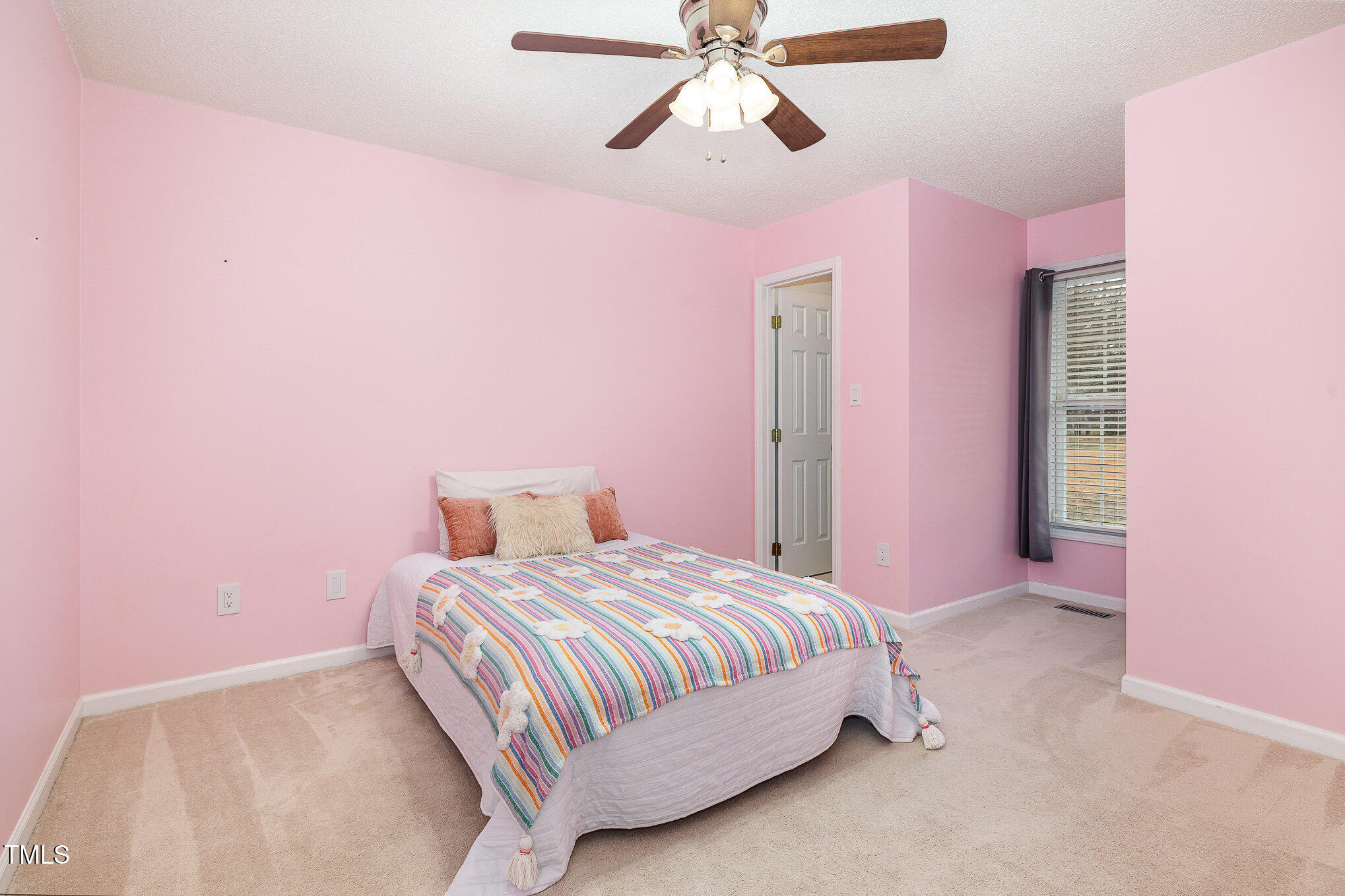3733 Polenta Road Clayton, NC 27520 - Photo 16 of 51 a bedroom with a bed and a chandelier