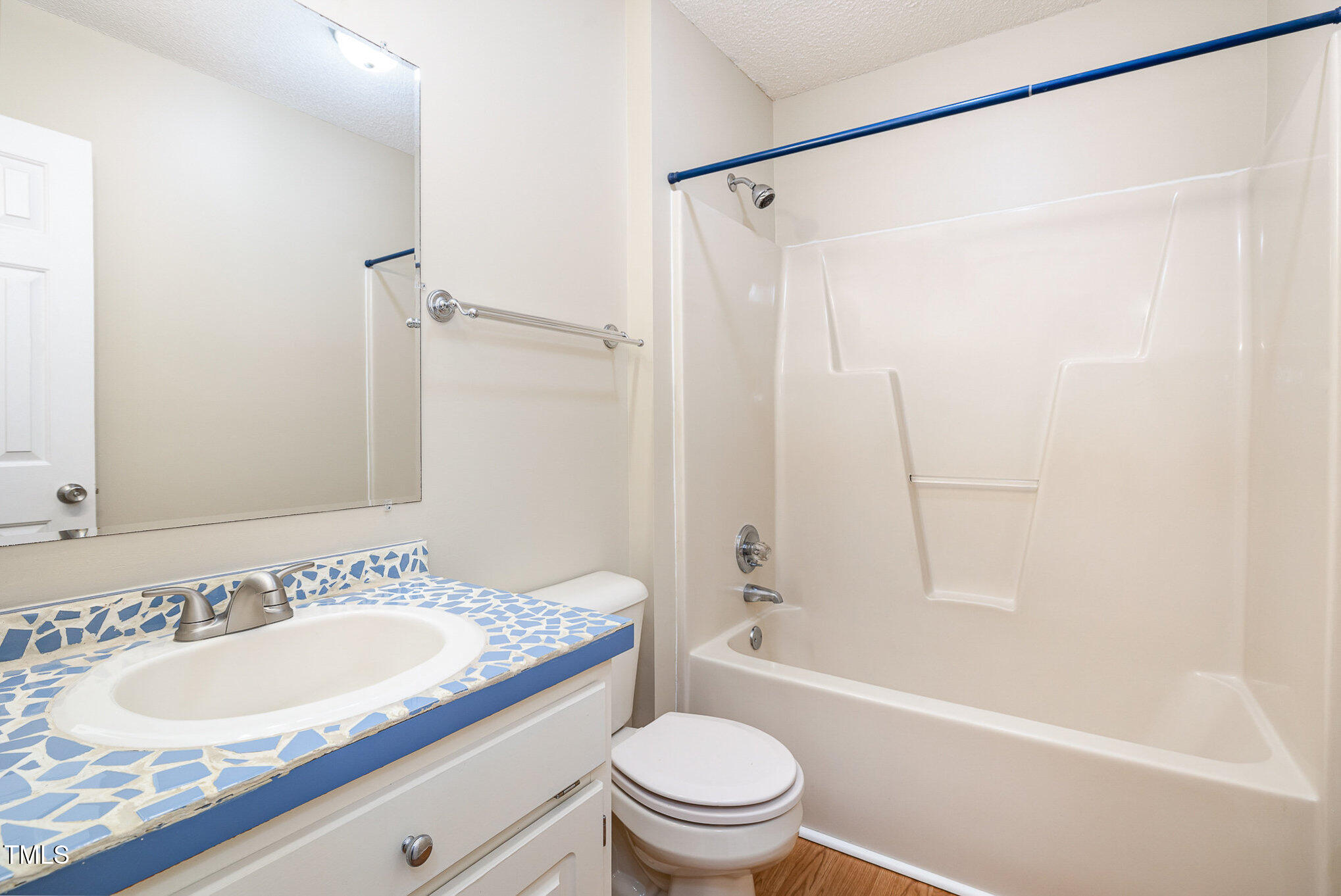 3733 Polenta Road Clayton, NC 27520 - Photo 17 of 51 a bathroom with a sink toilet and shower