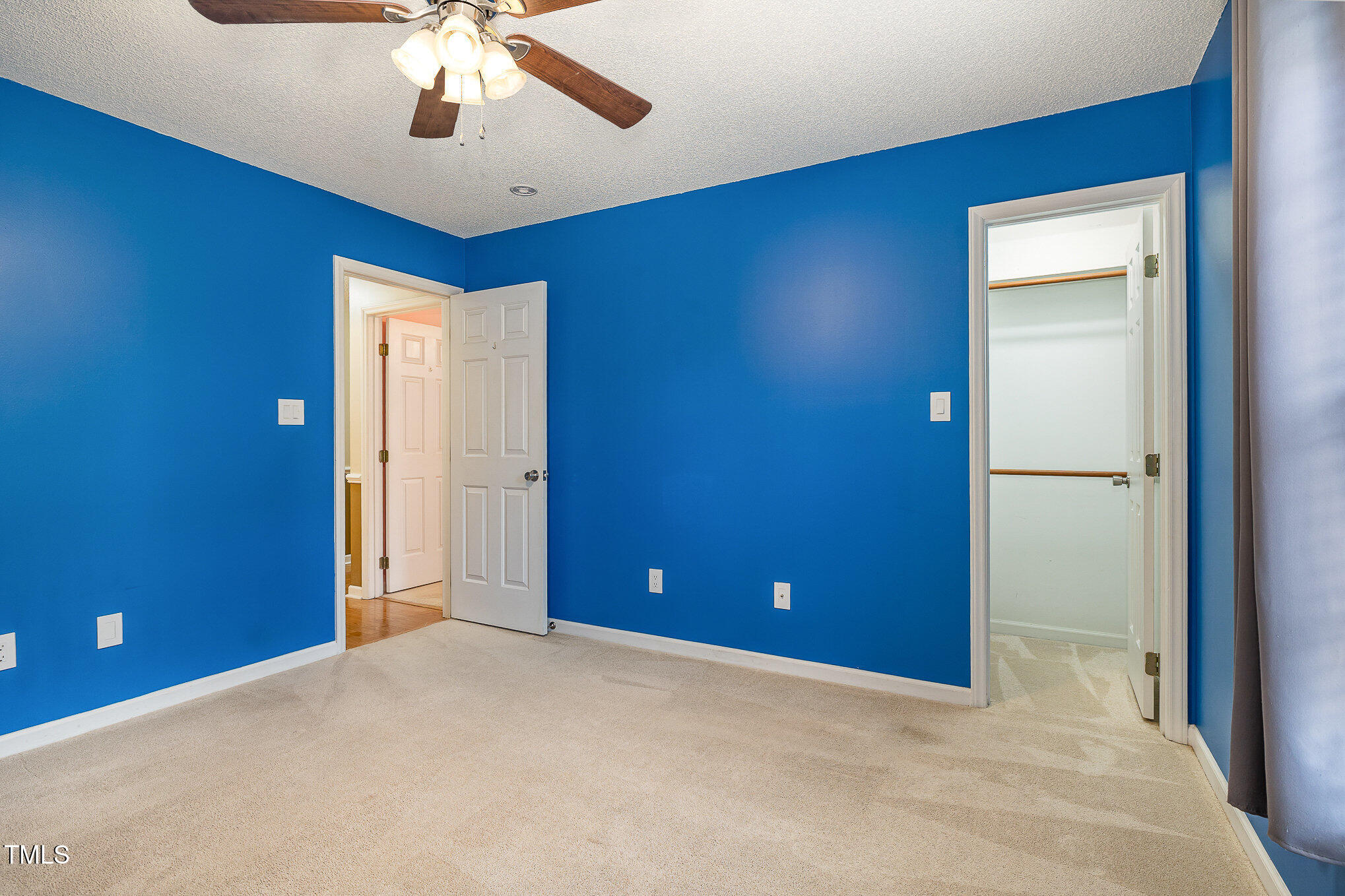 3733 Polenta Road Clayton, NC 27520 - Photo 18 of 51 a view of a livingroom with a chandelier fan