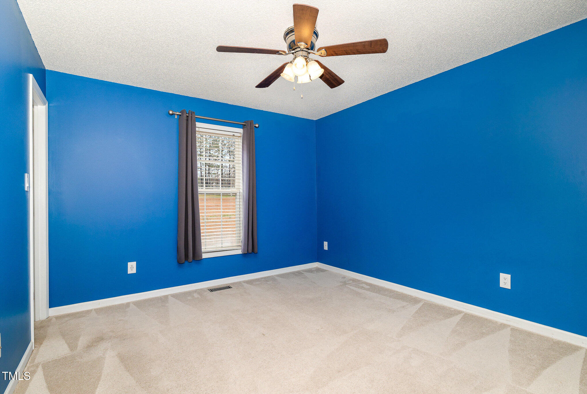 3733 Polenta Road Clayton, NC 27520 - Photo 19 of 51 a view of a big room with windows