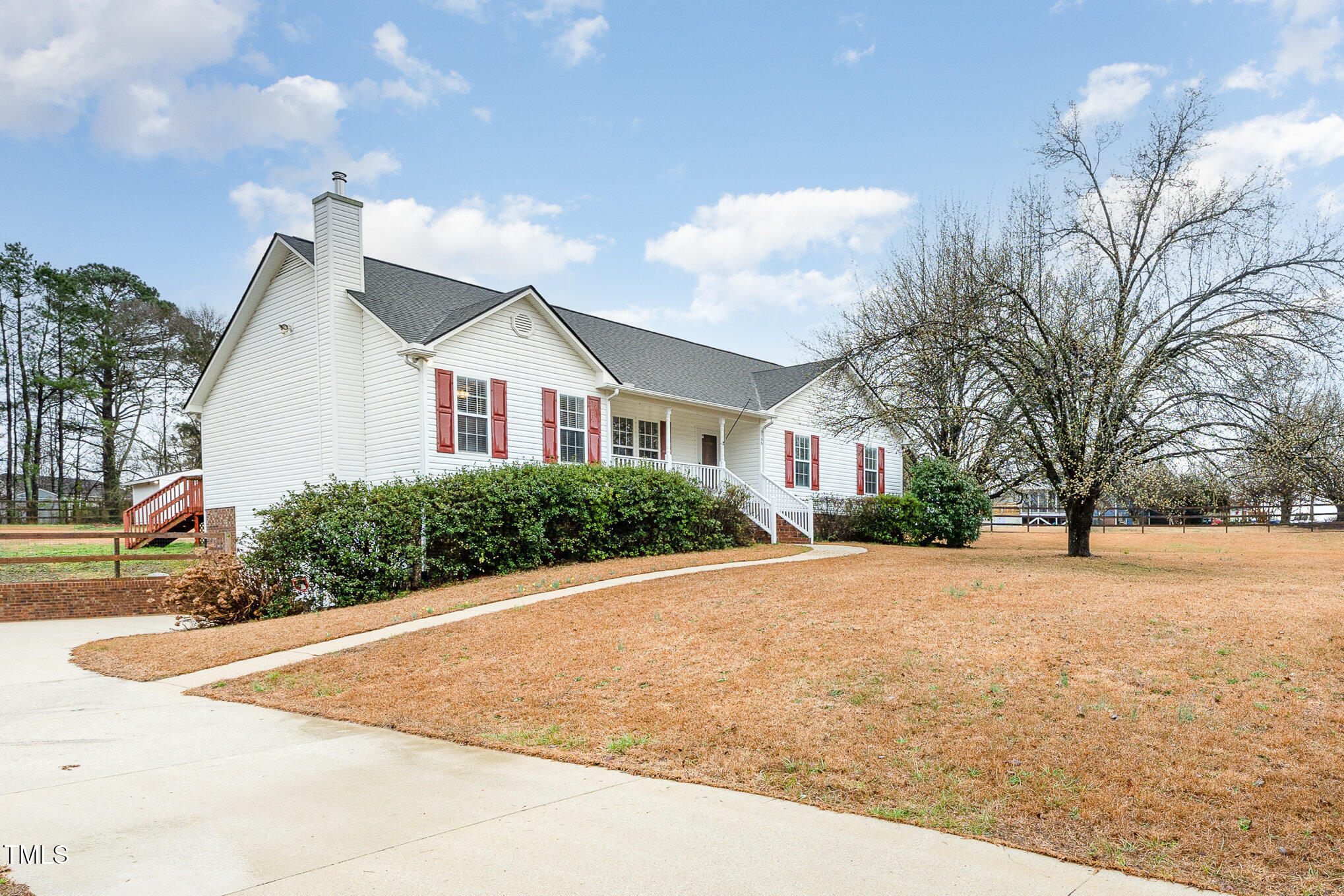 3733 Polenta Road Clayton, NC 27520 - Photo 2 of 51 a front view of a house with a yard and garage