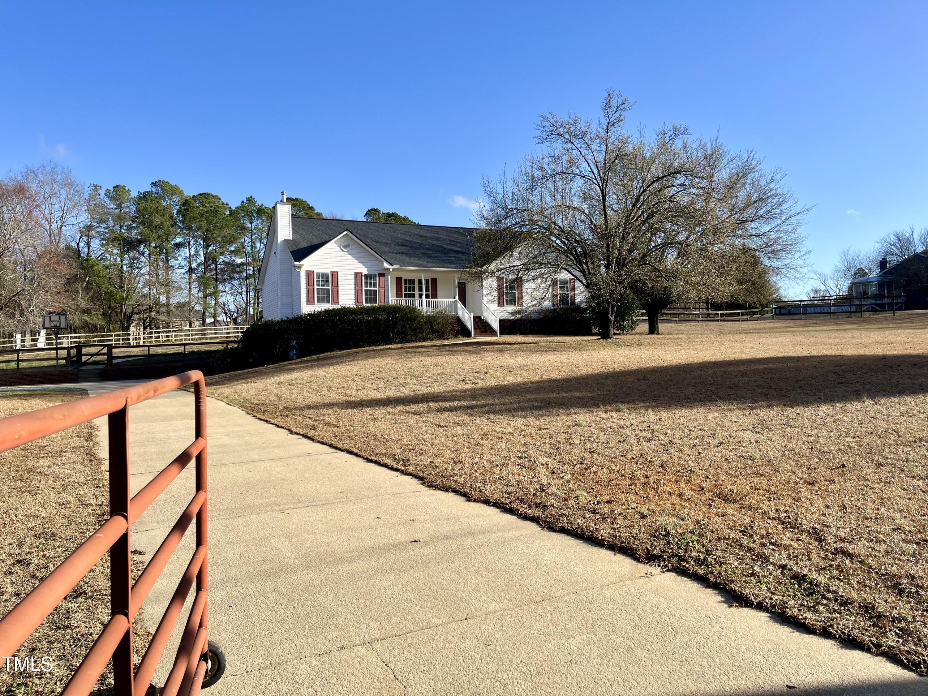 3733 Polenta Road Clayton, NC 27520 - Photo 35 of 51 a front view of a house with a yard