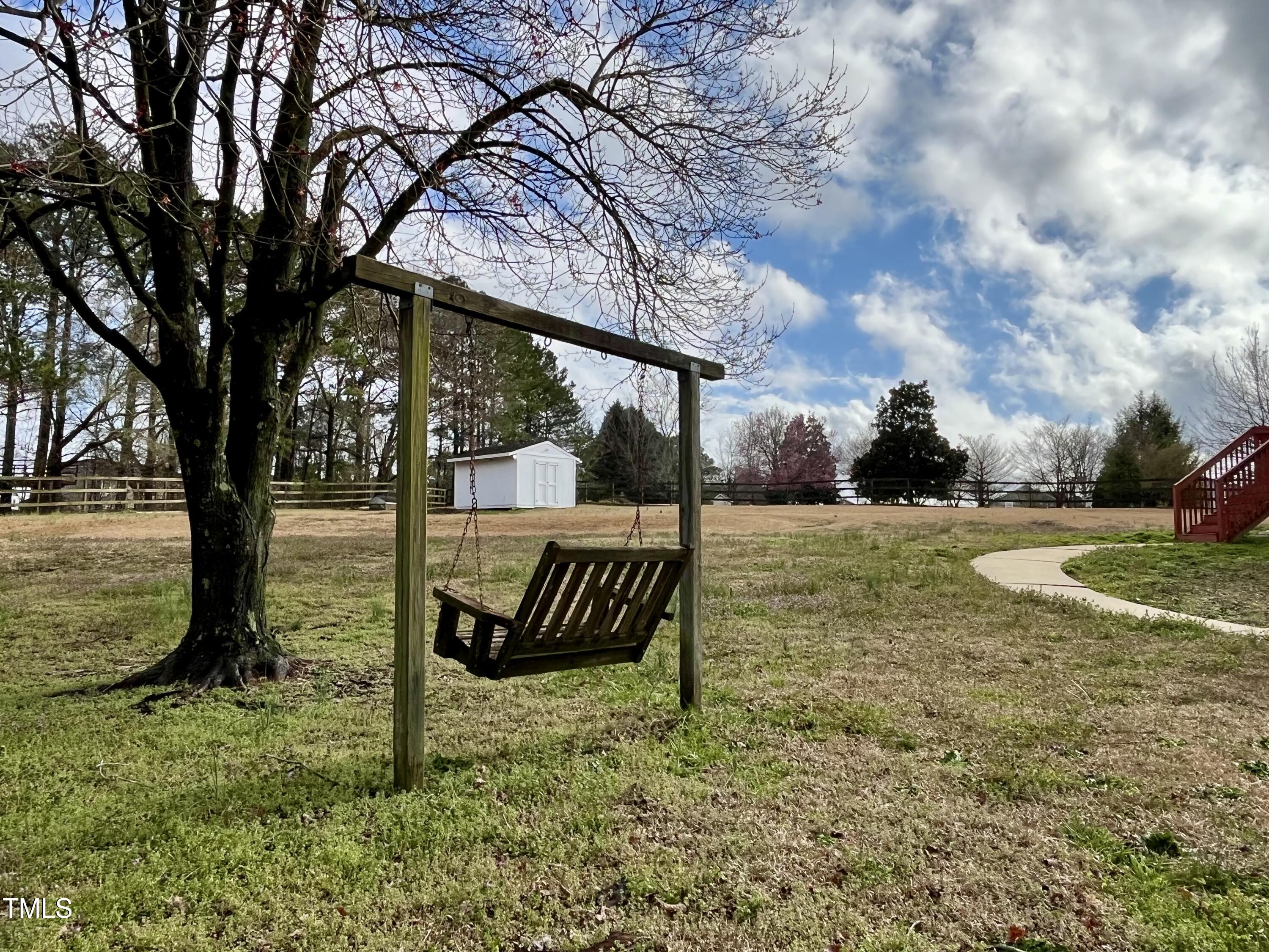 3733 Polenta Road Clayton, NC 27520 - Photo 38 of 51 a view of a yard with a tree