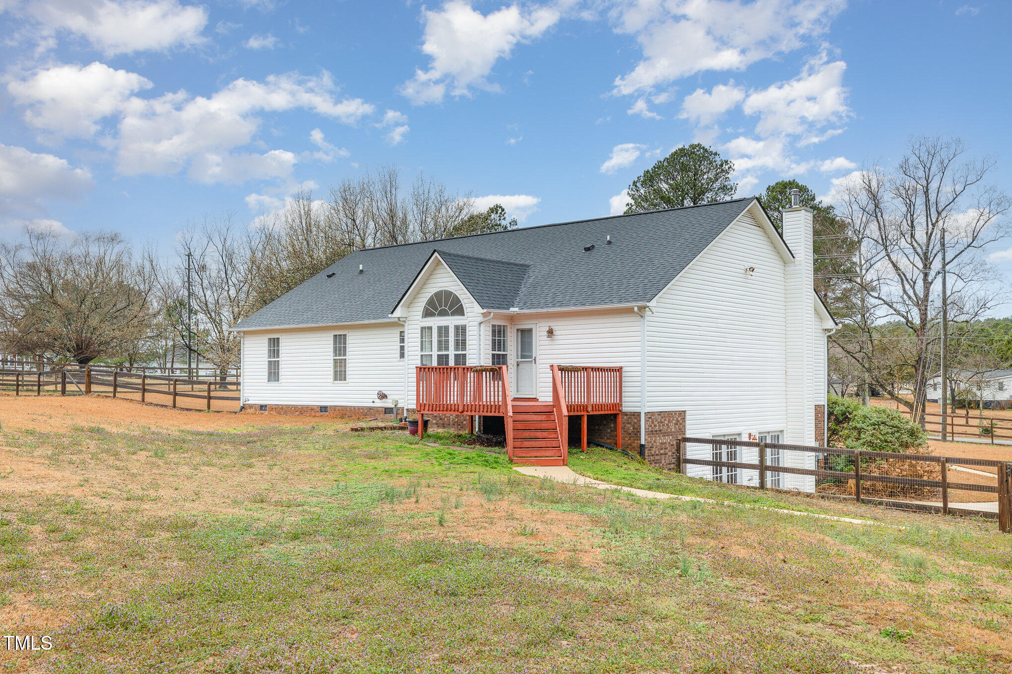 3733 Polenta Road Clayton, NC 27520 - Photo 40 of 51 a view of a house next to a big yard with large trees