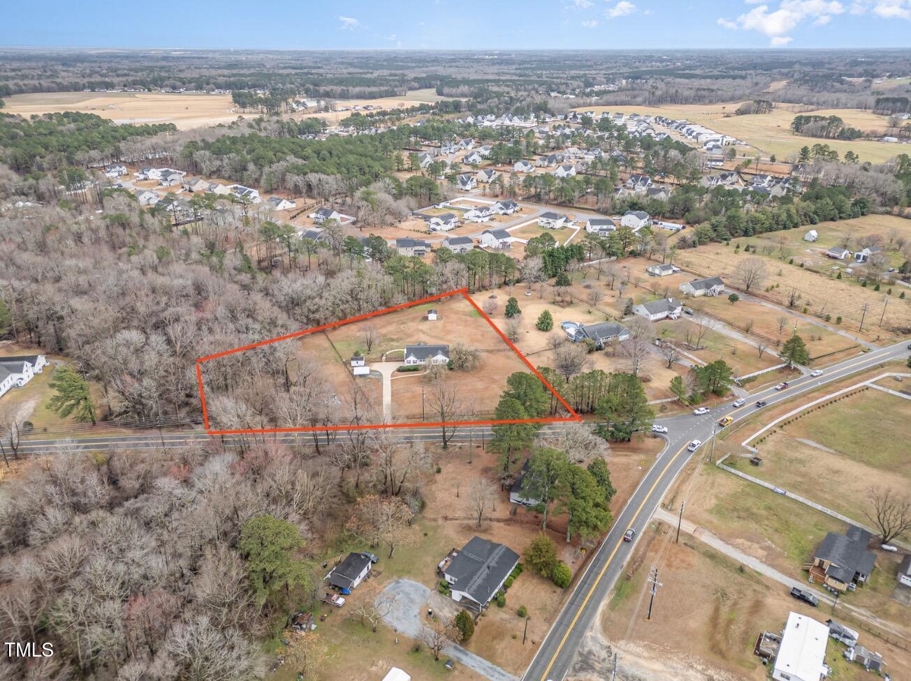 3733 Polenta Road Clayton, NC 27520 - Photo 44 of 51 an aerial view of ocean with residential house and ocean view