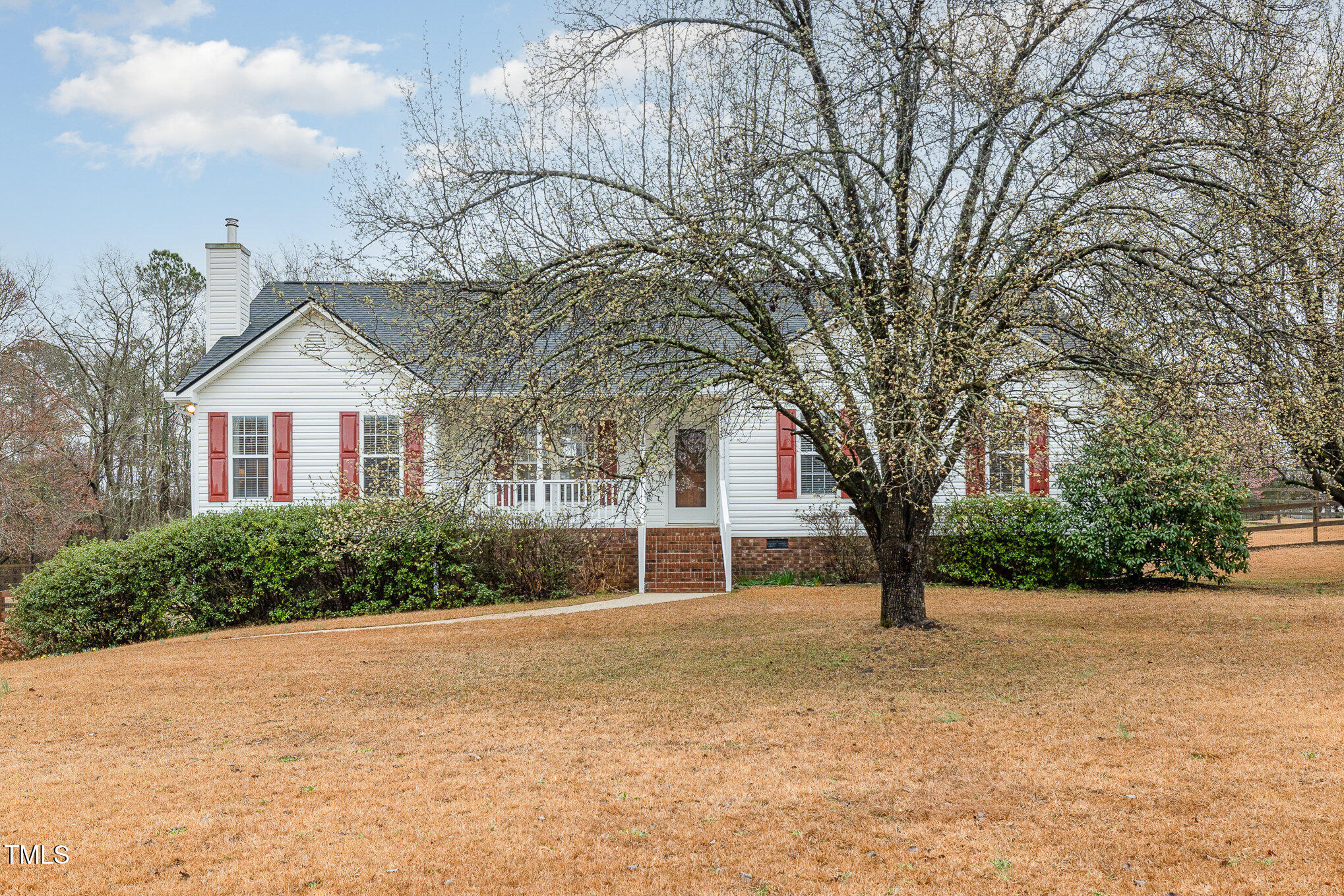 3733 Polenta Road Clayton, NC 27520 - Photo 3 of 51 a front view of a house with a yard and garage