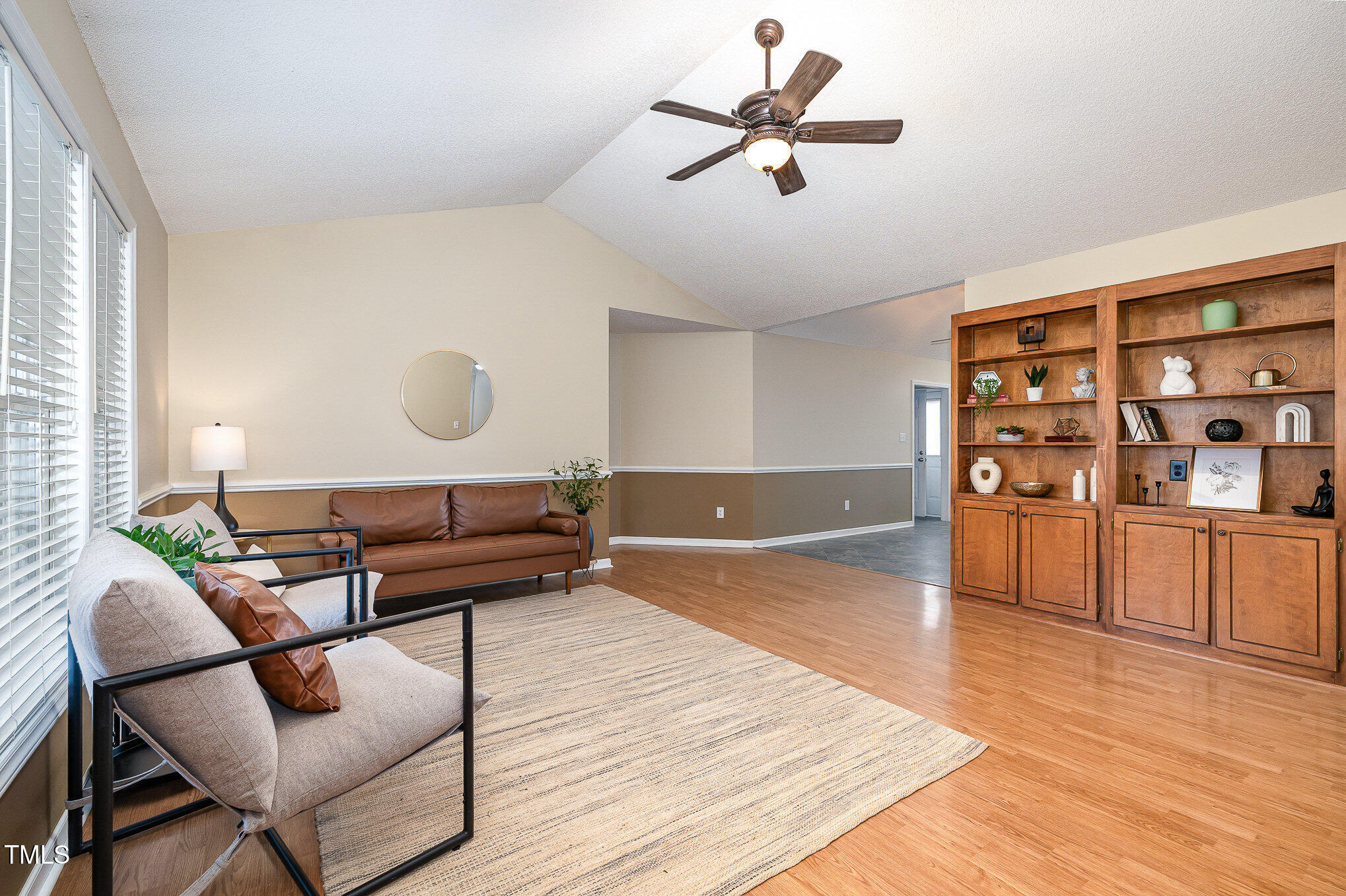 3733 Polenta Road Clayton, NC 27520 - Photo 4 of 51 a living room with furniture and wooden floor