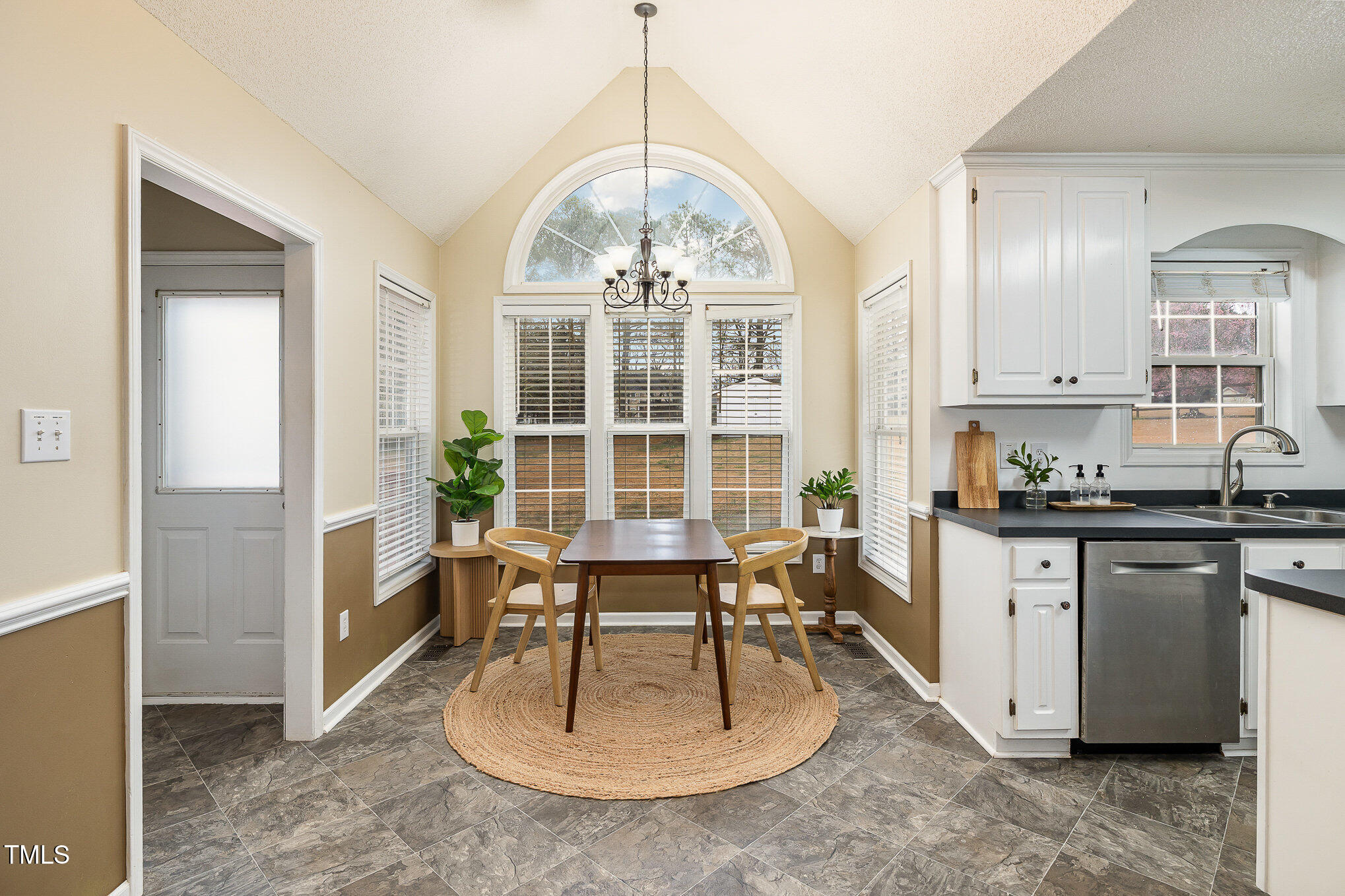 3733 Polenta Road Clayton, NC 27520 - Photo 6 of 51 a view of a kitchen with granite countertop a counter space a sink and appliances