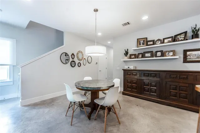 a kitchen with a table and chairs in it