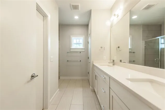 a view of a hallway with wooden floor and entryway