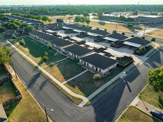a view of swimming pool with outdoor seating and city view