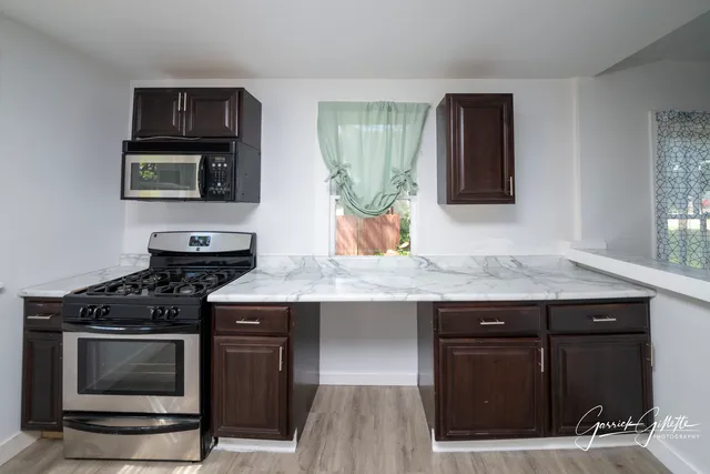 a kitchen with a stove and a sink