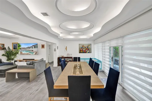 a view of a kitchen with a sink stainless steel appliances and cabinets