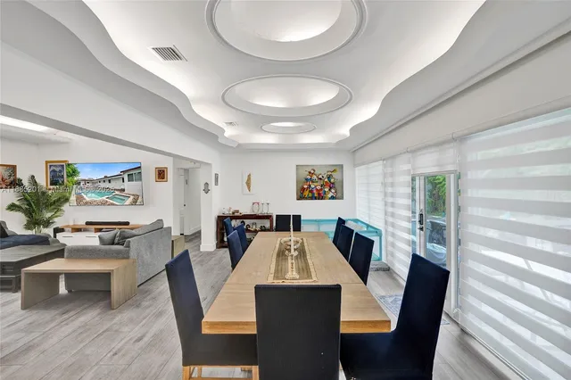 a view of a kitchen with a sink stainless steel appliances and cabinets