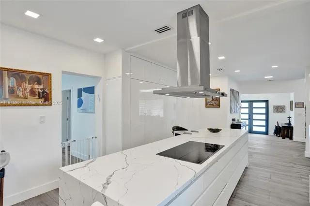 a bathroom with a sink toilet vanity and shower