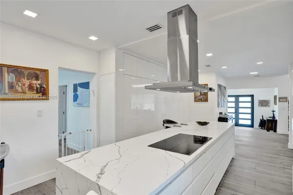 a bathroom with a sink toilet vanity and shower