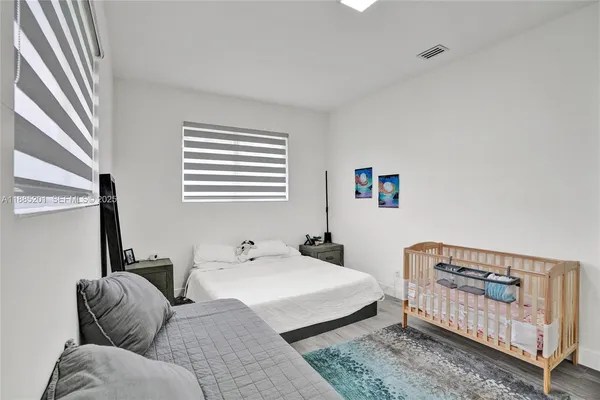 a living room with a couch and dresser