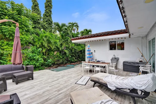 a view of a swimming pool with a patio