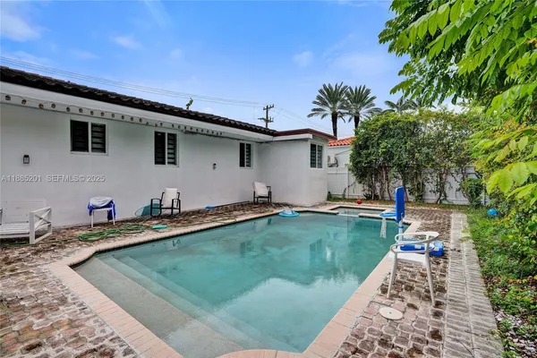 a view of a house with swimming pool