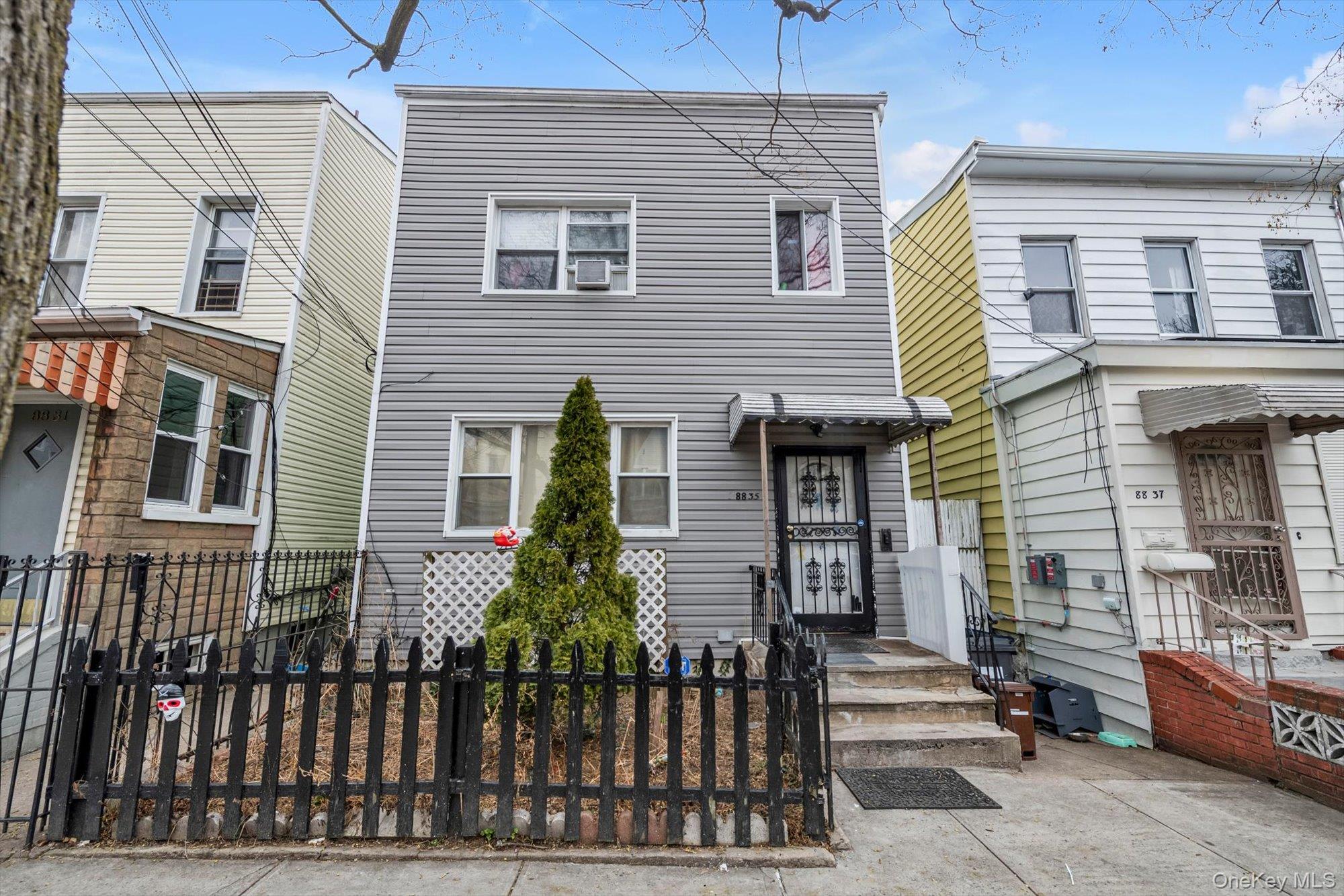88-35 75th Street Queens, NY 11421 - Photo 1 of 11 a front view of a house