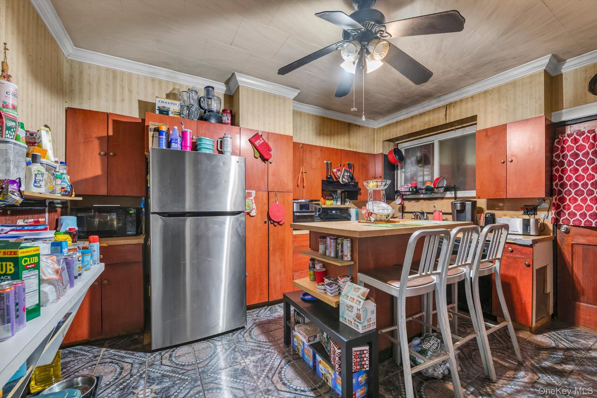 88-35 75th Street Queens, NY 11421 - Photo 4 of 11 a view of a kitchen with appliances and cabinets