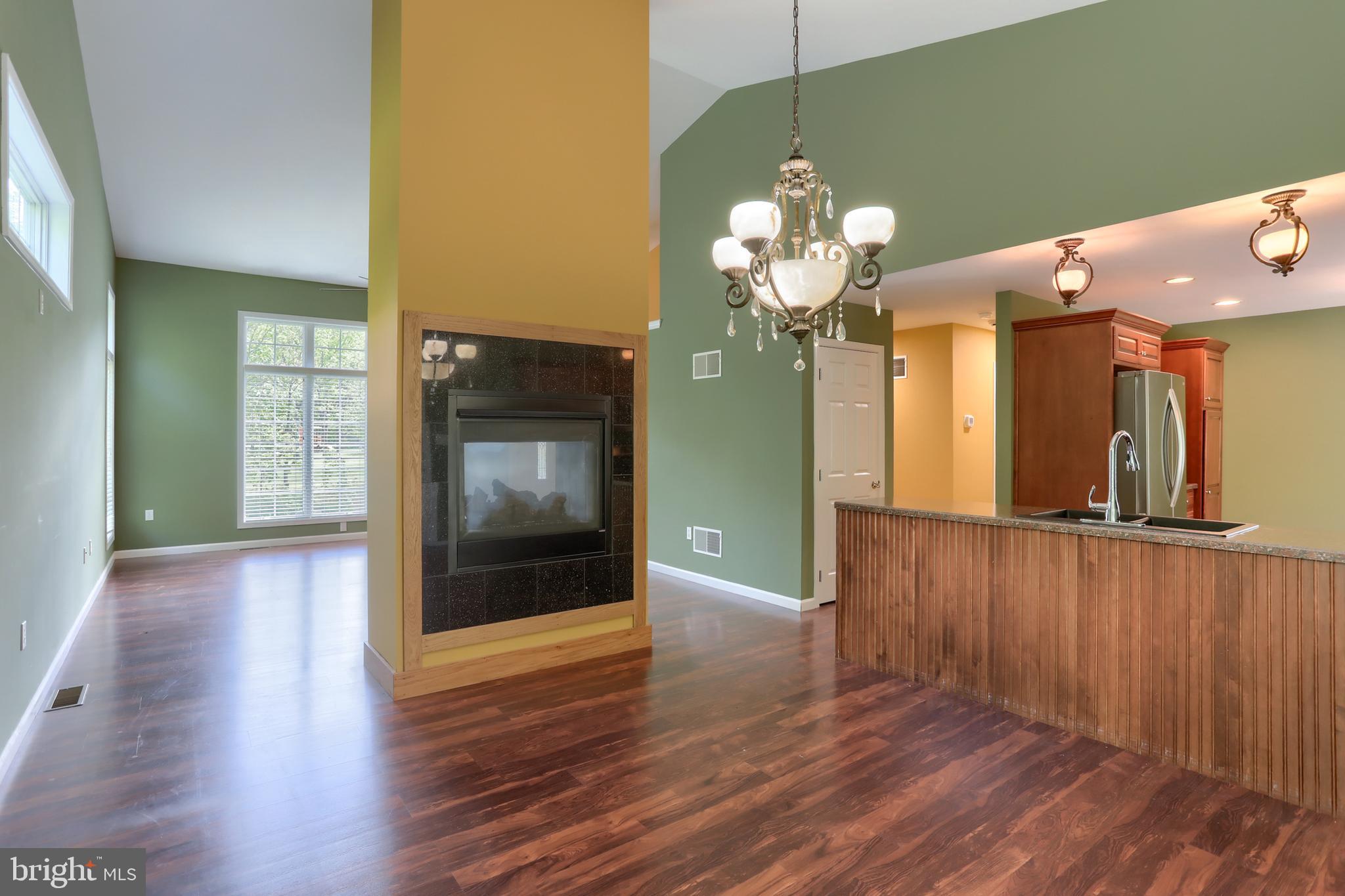 112 Crooked Hill Road Hummelstown, PA 17036 - Photo 11 of 51 a view of a room with wooden floor and chandelier