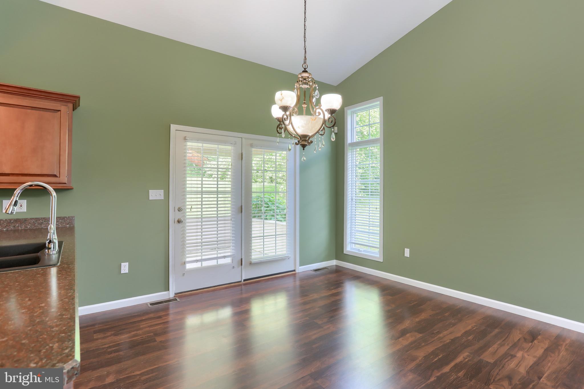 112 Crooked Hill Road Hummelstown, PA 17036 - Photo 12 of 51 a view of an empty room with window and wooden floor