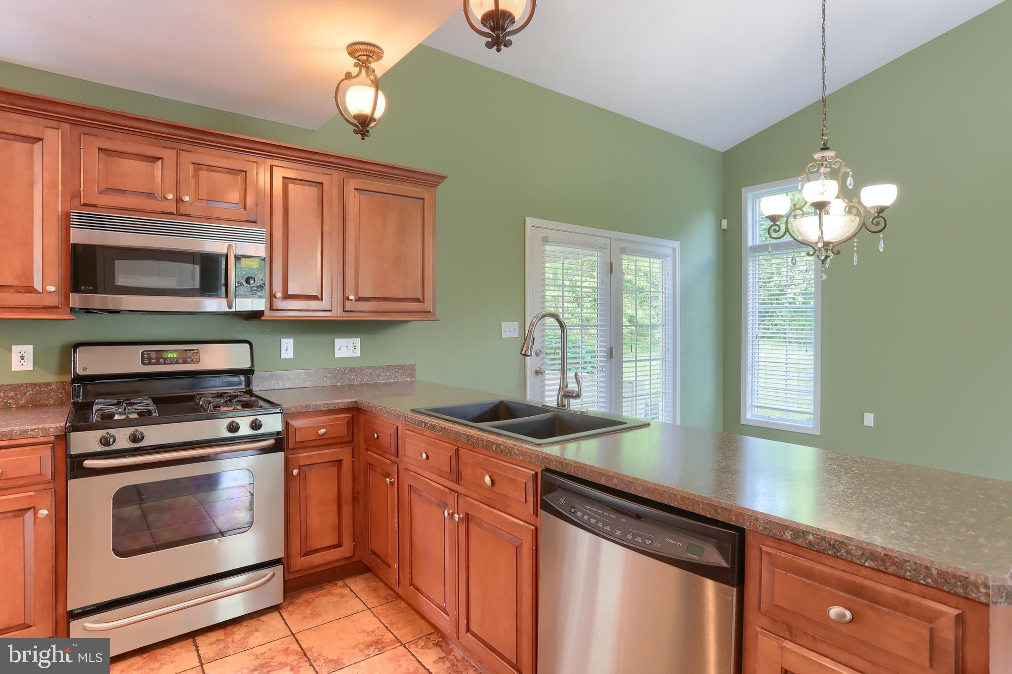 112 Crooked Hill Road Hummelstown, PA 17036 - Photo 13 of 51 a kitchen with stainless steel appliances granite countertop a sink and cabinets