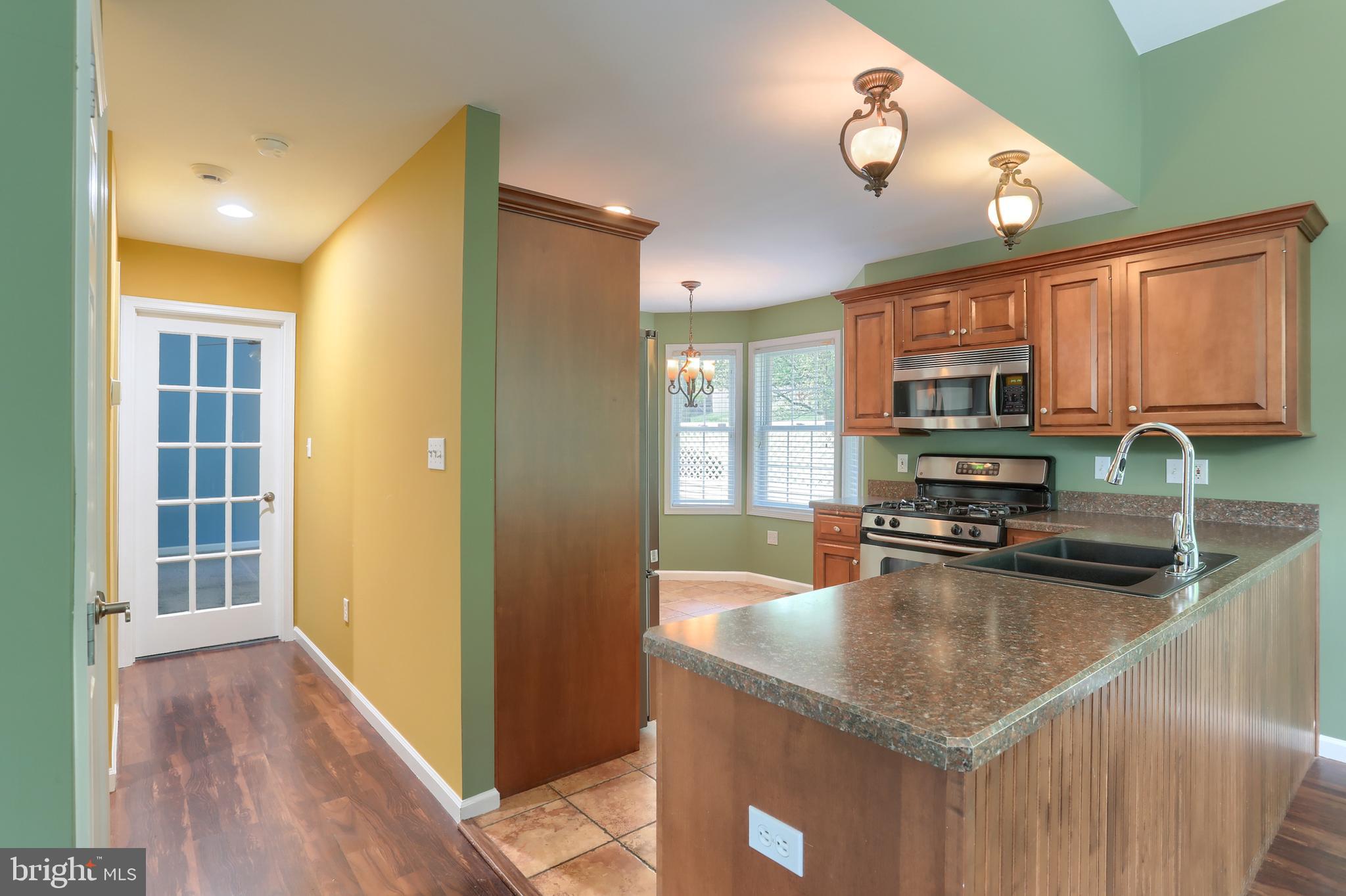 112 Crooked Hill Road Hummelstown, PA 17036 - Photo 14 of 51 a kitchen with stainless steel appliances granite countertop a sink a stove and cabinets