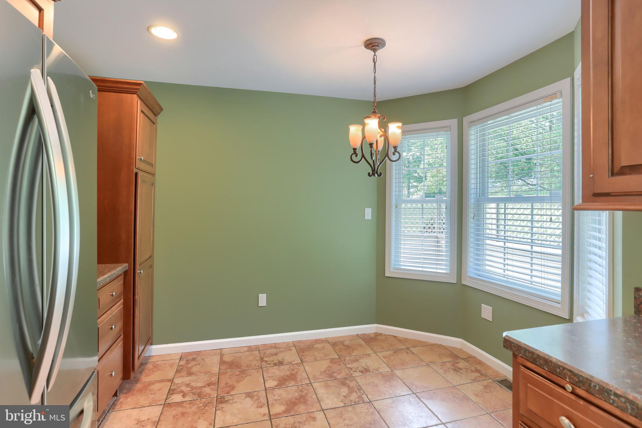112 Crooked Hill Road Hummelstown, PA 17036 - Photo 16 of 51 a view of a livingroom with a chandelier curtains and large windows