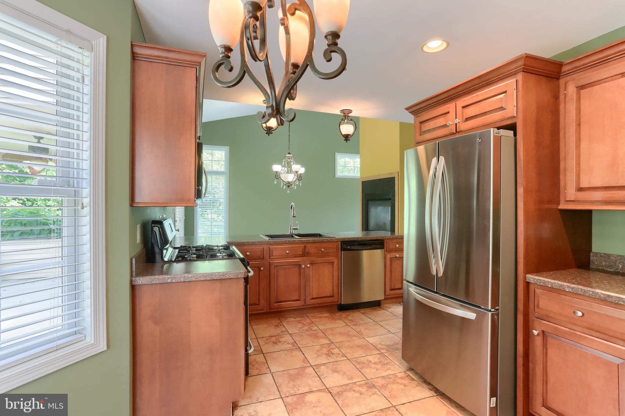 112 Crooked Hill Road Hummelstown, PA 17036 - Photo 17 of 51 a kitchen with stainless steel appliances granite countertop a refrigerator and a sink