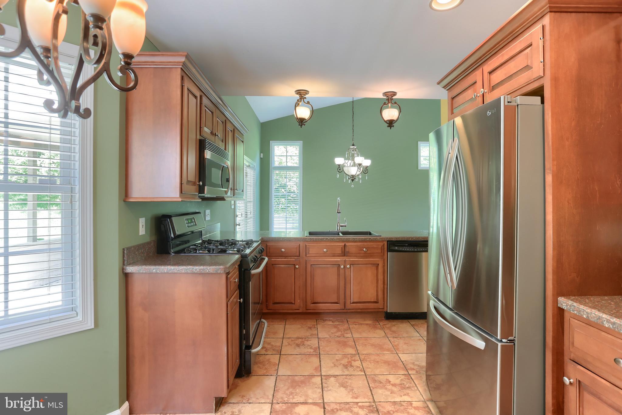 112 Crooked Hill Road Hummelstown, PA 17036 - Photo 18 of 51 a kitchen with granite countertop a refrigerator and a sink