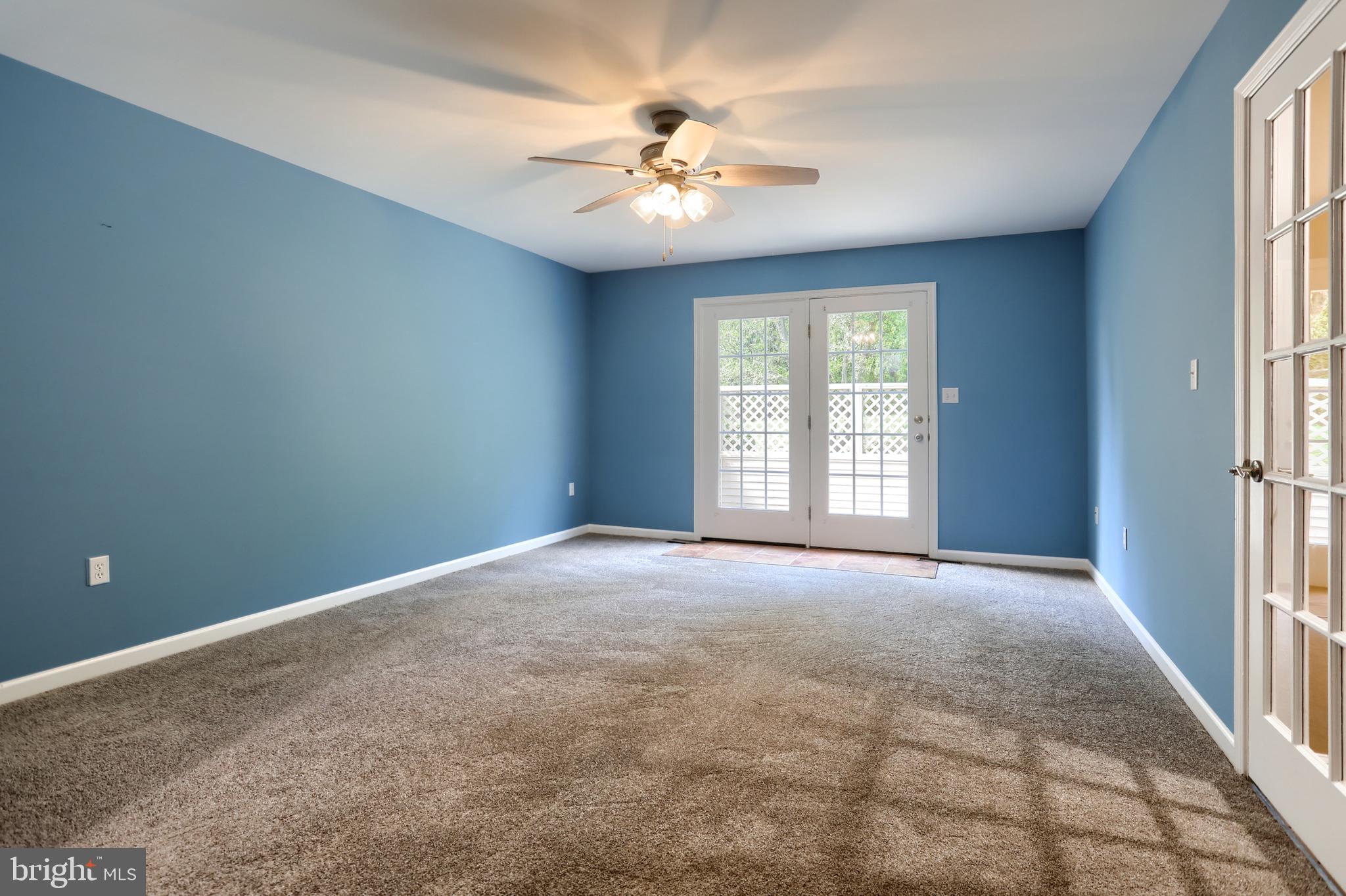 112 Crooked Hill Road Hummelstown, PA 17036 - Photo 22 of 51 an empty room with windows and chandelier fan