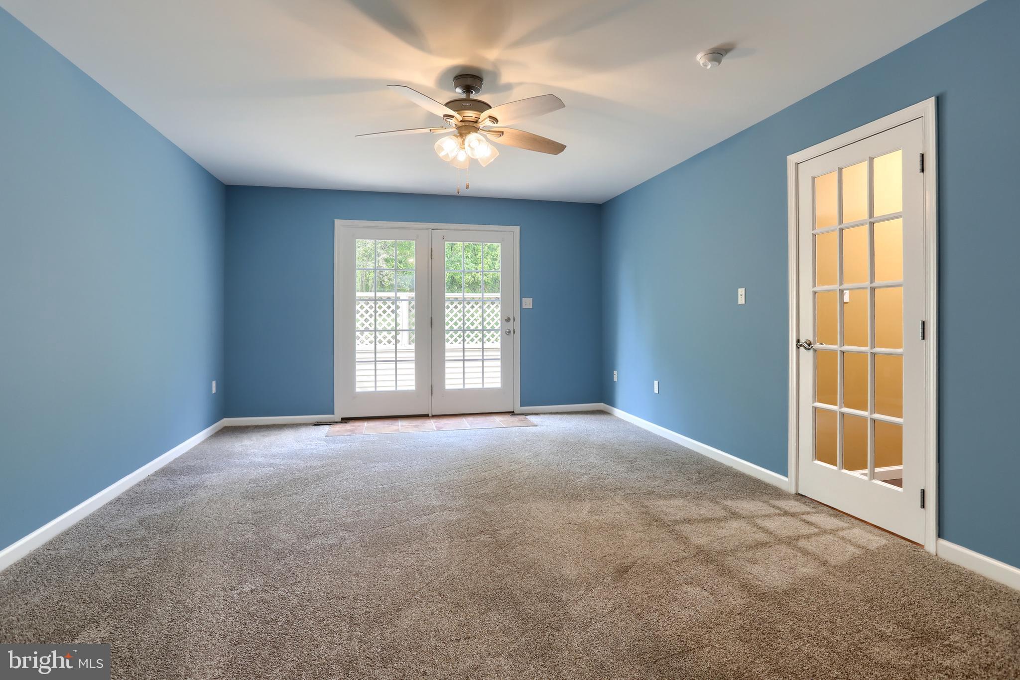 112 Crooked Hill Road Hummelstown, PA 17036 - Photo 23 of 51 an empty room with windows and chandelier fan