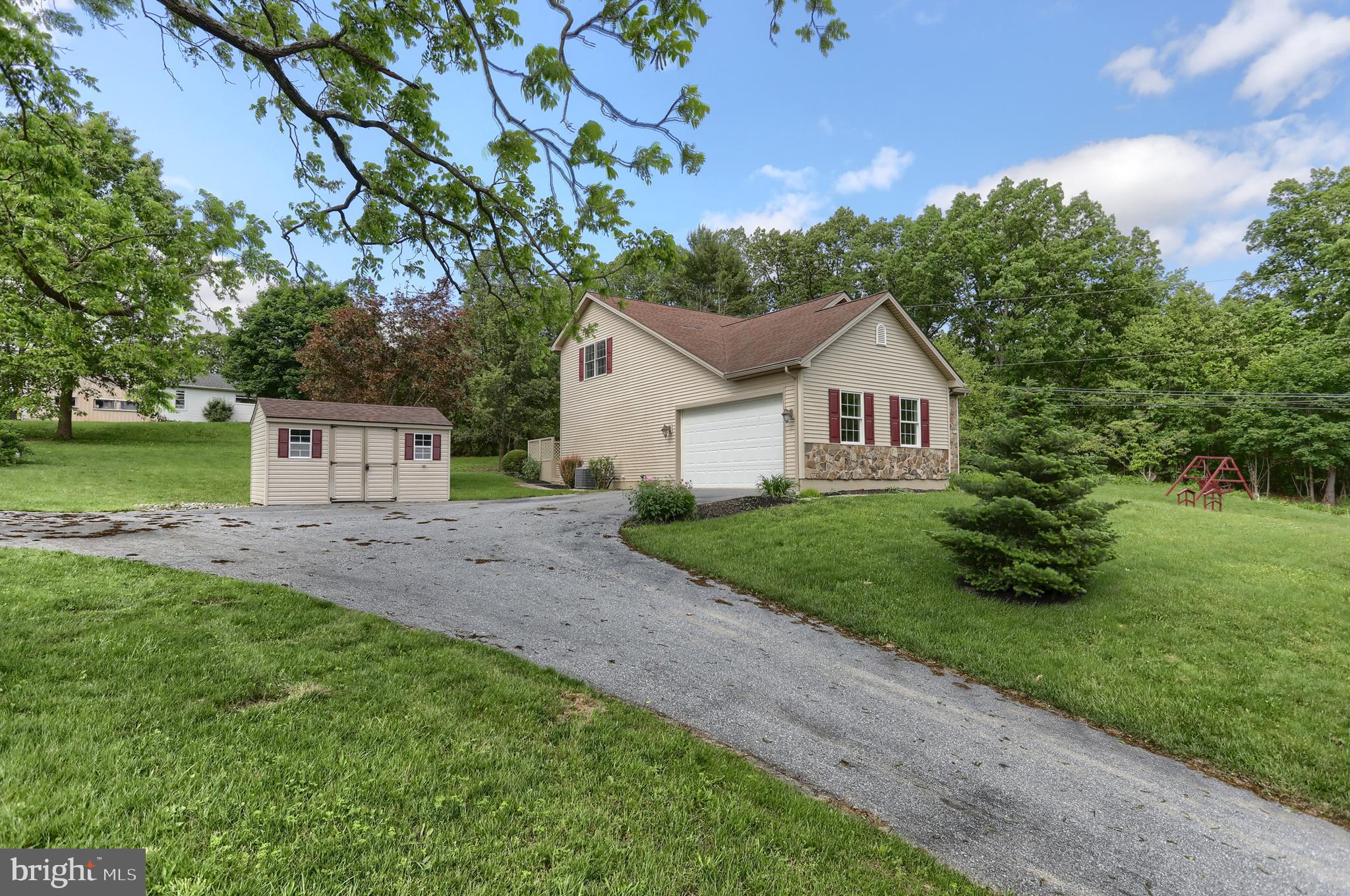 112 Crooked Hill Road Hummelstown, PA 17036 - Photo 39 of 51 a view of a house with a yard and a garden