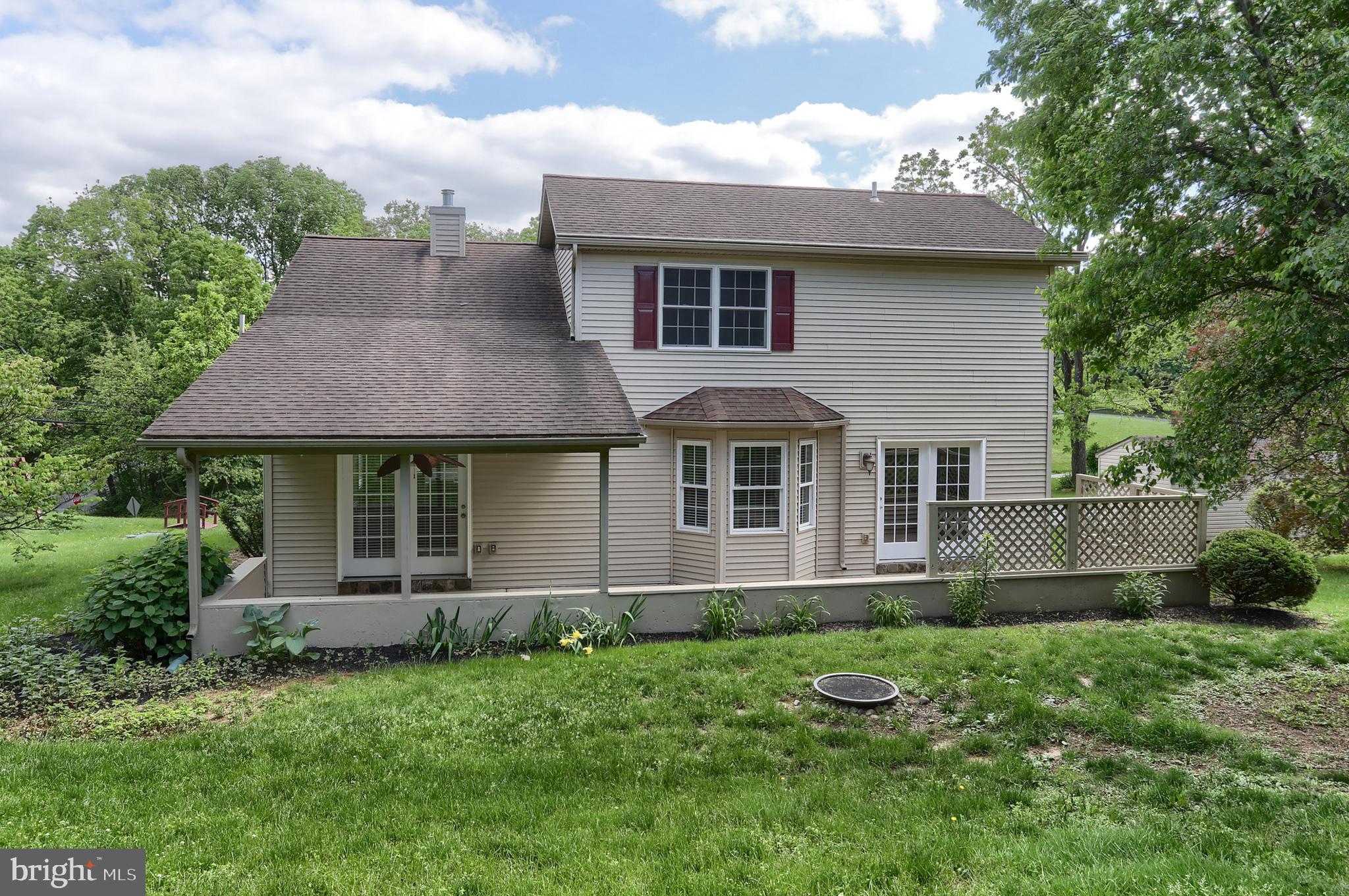 112 Crooked Hill Road Hummelstown, PA 17036 - Photo 47 of 51 a front view of a house with a yard and potted plants