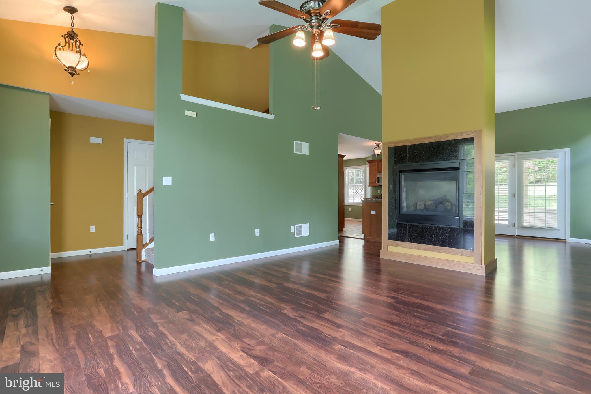 112 Crooked Hill Road Hummelstown, PA 17036 - Photo 6 of 51 a view of an empty room with window and wooden floor