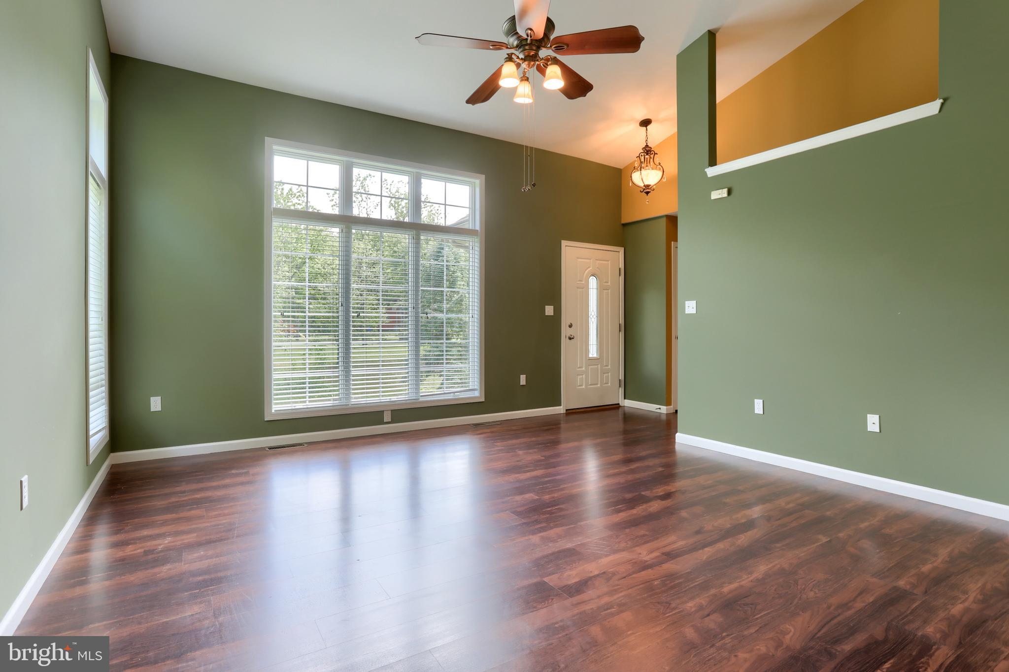 112 Crooked Hill Road Hummelstown, PA 17036 - Photo 8 of 51 a view of an empty room with window and wooden floor