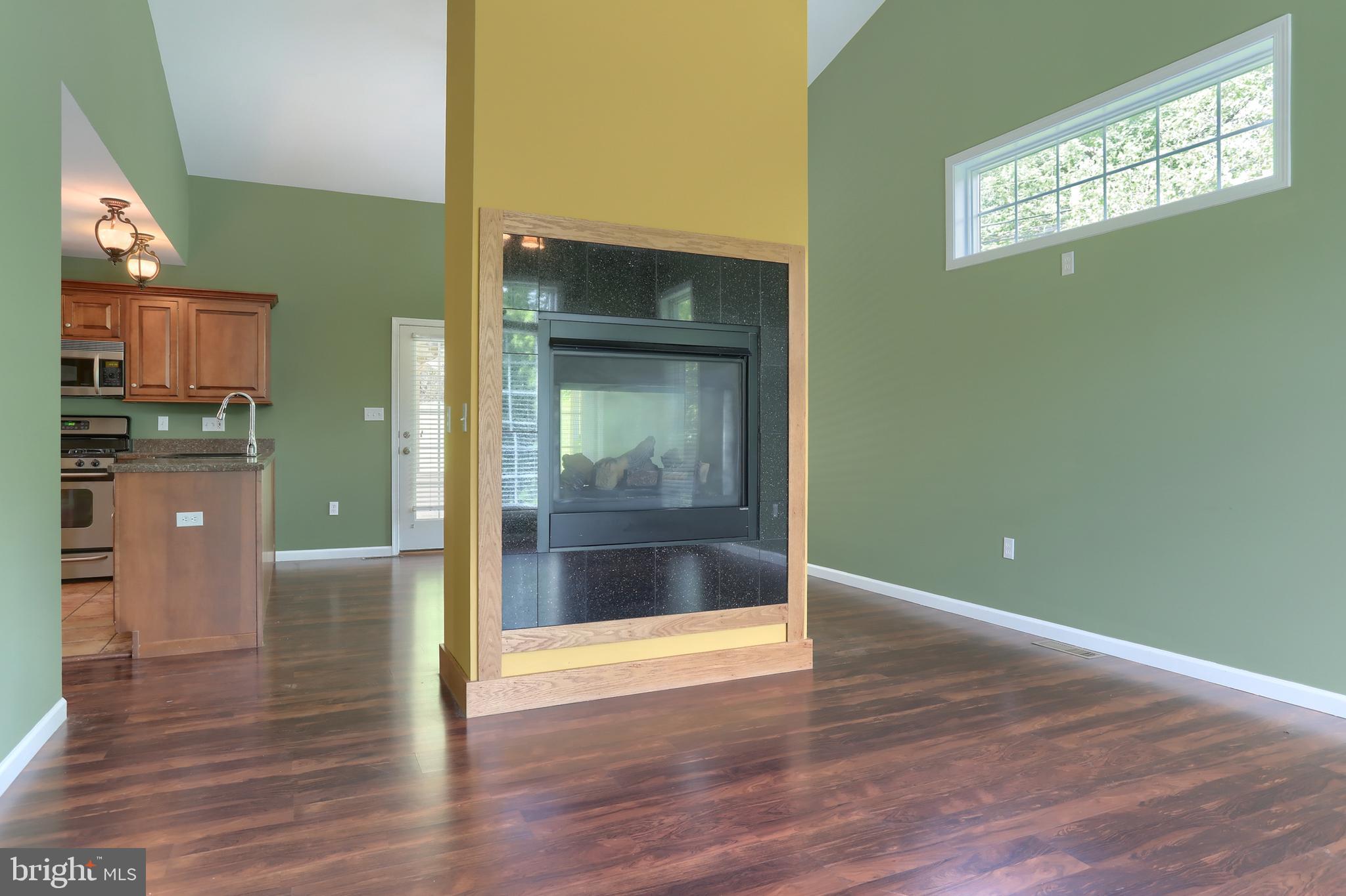 112 Crooked Hill Road Hummelstown, PA 17036 - Photo 9 of 51 a view of a hallway with wooden floor and a living room