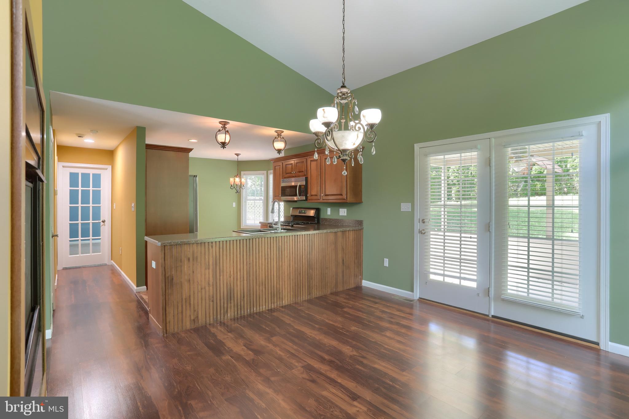 112 Crooked Hill Road Hummelstown, PA 17036 - Photo 10 of 51 a view of a kitchen with a sink wooden floor and chandelier