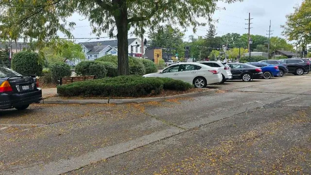 a view of cars parked on the side of a street