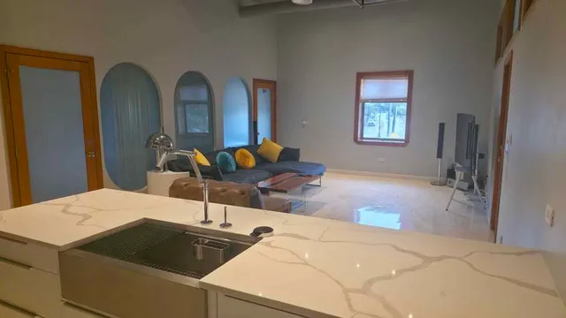 a bed room with a bed and a mirror