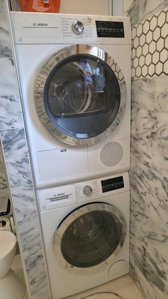 110 West Bartlett Avenue, Unit 101 Bartlett, IL 60103 - Photo 7 of 7 a utility room with dryer and washer