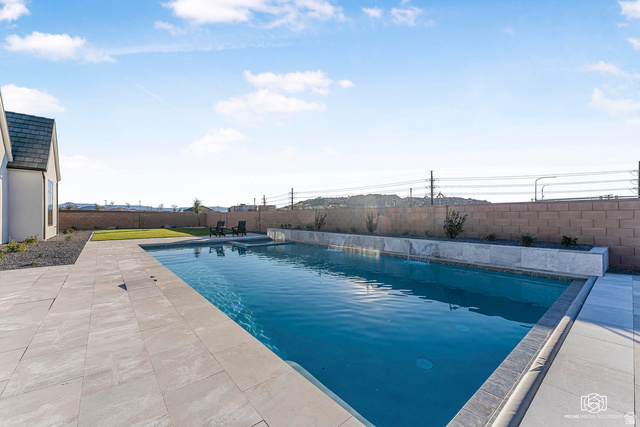 1468 South Red Cliffs Temple Lane St. George, UT 84790 - Photo 54 of 64 View of swimming pool featuring patio surround and a fenced backyard