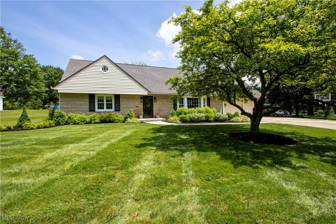416 East Beverly Road Wooster, OH 44691 - Photo 2 of 36 View of front facade with a front yard, concrete driveway, roof with shingles, and a garage